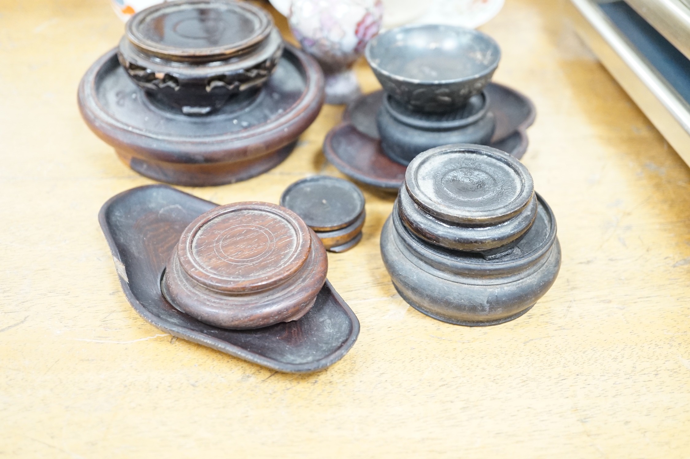 A group of Japanese Satsuma pottery, other ceramics, wood stands etc, a pair of vases 18cms high